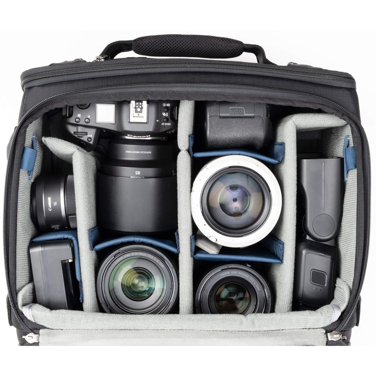 
                  
                    2 gripped camera bodies with lenses attached, 1-2 additional lenses, and/or two flashes 
                  
                
