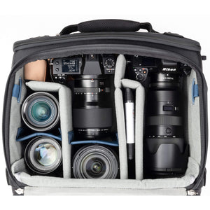 2 gripped camera bodies with lenses attached, 1-2 additional lenses, and/or two flashes