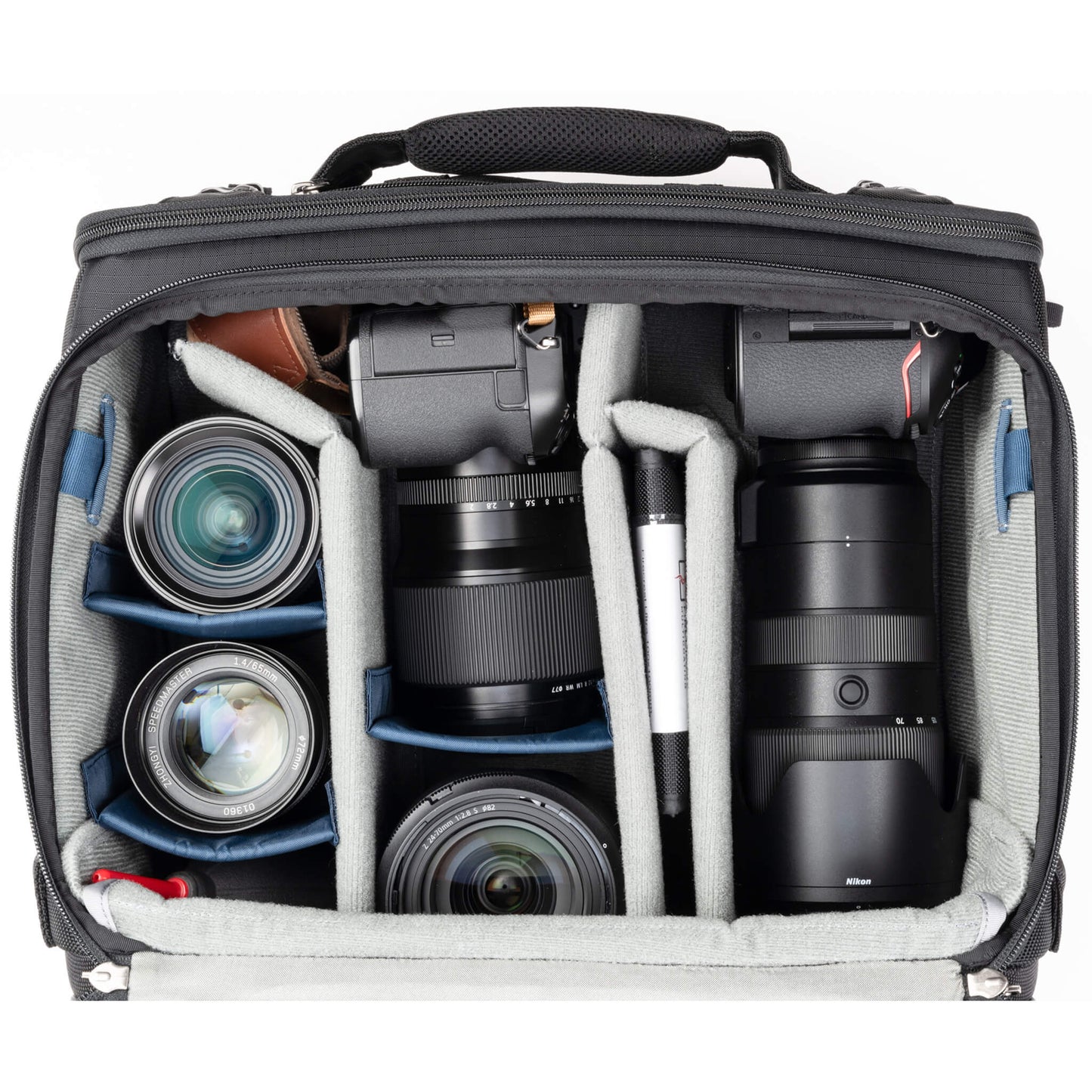 
                  
                    2 standard camera bodies with lenses attached, 1-2 additional lenses, and/or two flashes 
                  
                