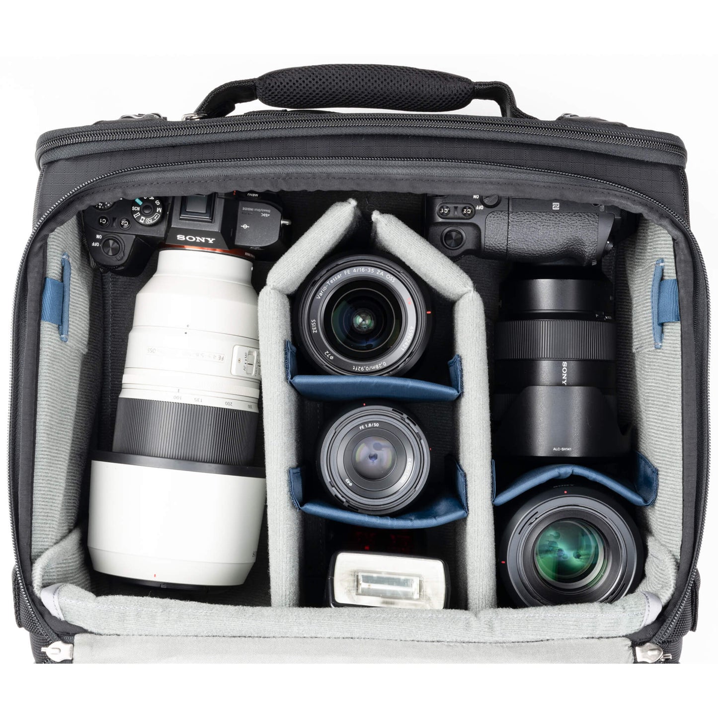
                  
                    2 gripped camera bodies with lenses attached, 1-2 additional lenses, and/or two flashes 
                  
                