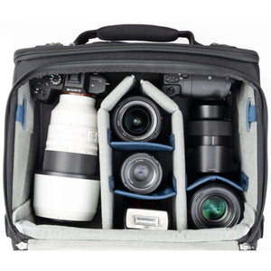 2 gripped camera bodies with lenses attached, 1-2 additional lenses, and/or two flashes