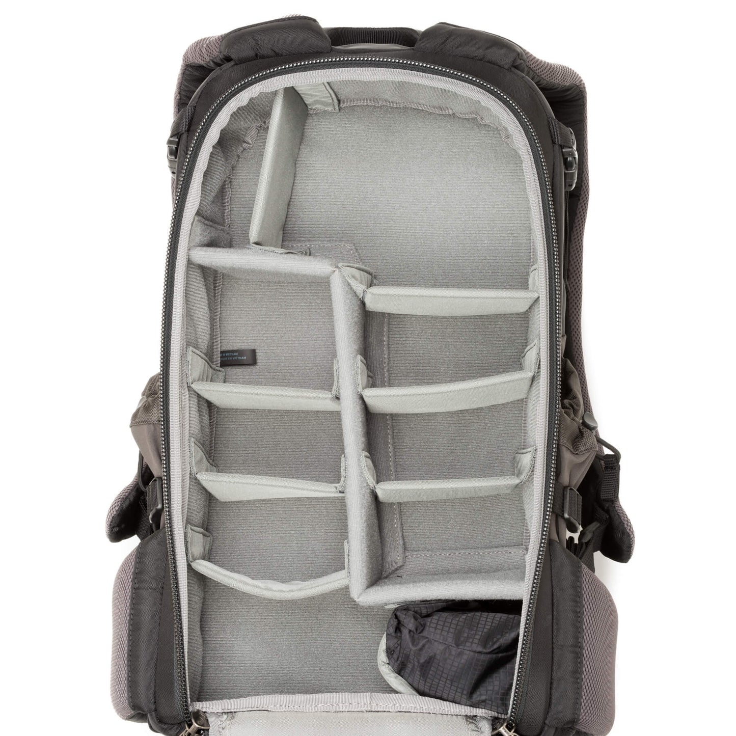 
                  
                    Adjustable dividers for large telephoto lenses, traditional photo gear, or personal items
                  
                